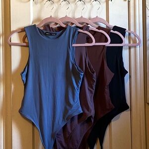 Shein bodysuit bundle (4 bodysuits). 3 are women’s size 6. One is women’s size 4